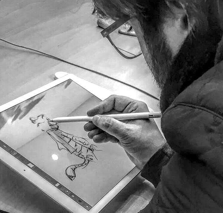 Alex sketching on a tablet